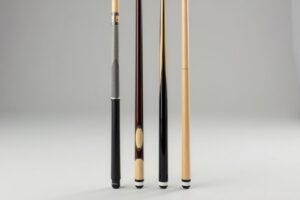 Collection of four quality beginner pool cues at different price points displayed for comparison