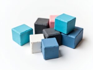 Comparison of premium and budget pool chalk brands arranged showing different cube colors and quality levels