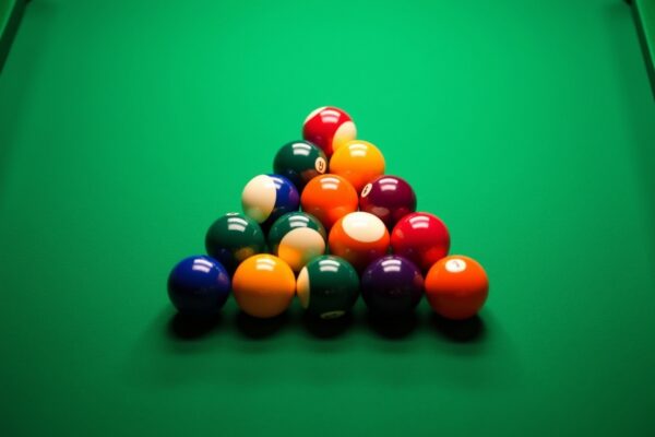 Side-by-side comparison of triangle rack for 8-ball and diamond rack for 9-ball on pool tablev