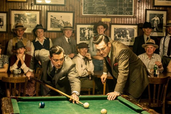 Vintage pool tournament scene from golden age showing spectators and classic pool hall atmosphere